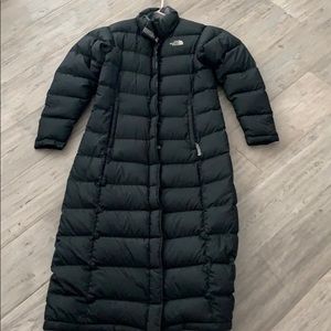 Woman’s ankle length North Face down jacket